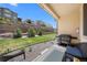Backyard with a patio, outdoor grill, landscaping and retaining wall at 12214 Stone Timber Ct, Parker, CO 80134