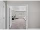 Bedroom view showing neutral carpet, a large window, and a gray couch at 12214 Stone Timber Ct, Parker, CO 80134
