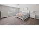 Spacious bedroom with soft natural light, bed, dresser, and bedside tables at 12214 Stone Timber Ct, Parker, CO 80134