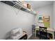 Functional closet space with shelving, a small desk, and storage for organization at 12214 Stone Timber Ct, Parker, CO 80134