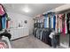 Walk-in closet with ample hanging space, shelving, and a white dresser at 12214 Stone Timber Ct, Parker, CO 80134