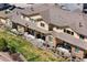 Backyard view features well-maintained patio areas, landscaping, outdoor seating, and BBQ grills at 12214 Stone Timber Ct, Parker, CO 80134