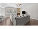 Cozy living room featuring a fireplace, stylish console, and comfortable gray sectional couch at 12214 Stone Timber Ct, Parker, CO 80134