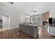 Open-concept living room with a stone fireplace and lots of natural light at 12214 Stone Timber Ct, Parker, CO 80134