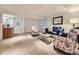 Cozy basement area featuring comfortable seating, a modern mirror, and recessed lighting at 10050 Eagle Valley Way, Highlands Ranch, CO 80129