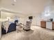 Basement area with plush carpet, comfortable seating, and built-in bar area at 10050 Eagle Valley Way, Highlands Ranch, CO 80129