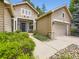 Inviting home featuring a well-manicured walkway leading to the front door and attached garage at 10050 Eagle Valley Way, Highlands Ranch, CO 80129