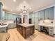 Modern kitchen with a large island, stylish cabinets, and stainless steel appliances at 10050 Eagle Valley Way, Highlands Ranch, CO 80129