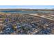 Aerial view of homes near a lake and highway at 8845 S Brentwood St, Littleton, CO 80128