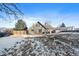 Large backyard with snow and a detached garage at 8845 S Brentwood St, Littleton, CO 80128