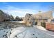 Large backyard with snow and a detached garage at 8845 S Brentwood St, Littleton, CO 80128