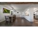 Bright dining room with wooden table and access to the kitchen and backyard at 8845 S Brentwood St, Littleton, CO 80128