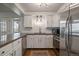 Updated kitchen featuring white shaker cabinets and stainless steel appliances at 8845 S Brentwood St, Littleton, CO 80128