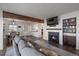 Cozy living room with a fireplace and access to the dining area at 8845 S Brentwood St, Littleton, CO 80128