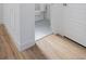 Bright hallway with hardwood floors leading to the bathroom at 10860 Lyric St, Lone Tree, CO 80134