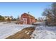 Red barn with large doors in snowy setting at 12626 N 1St St, Parker, CO 80134