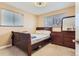 Bright bedroom with double bed and wood dresser at 12626 N 1St St, Parker, CO 80134
