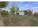 Back of house showing a patio and large yard at 12626 N 1St St, Parker, CO 80134