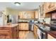 Kitchen with island, wood cabinets, and granite counters at 12626 N 1St St, Parker, CO 80134