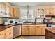 Kitchen with wood cabinets, granite counter, and appliances at 12626 N 1St St, Parker, CO 80134