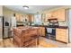 Eat-in kitchen with island, stainless steel appliances, and wood cabinets at 12626 N 1St St, Parker, CO 80134