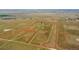 Aerial perspective showing the property's boundaries, house, and surrounding fields at 11881 County Road 37, Fort Lupton, CO 80621