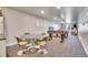 Finished basement game room with a foosball table, dining table, and comfortable seating at 11881 County Road 37, Fort Lupton, CO 80621