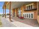 Spacious outdoor patio with a fireplace, dining area, and stunning views at 11881 County Road 37, Fort Lupton, CO 80621
