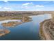 An aerial view of the lake in the community, including a community park and residential neighborhood at 12547 Lake View St, Longmont, CO 80504