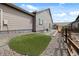 Backyard featuring a concrete patio, walkway, and a manicured lawn at 12547 Lake View St, Longmont, CO 80504