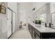 Modern bathroom featuring a double sink vanity and a glass-enclosed shower at 12547 Lake View St, Longmont, CO 80504