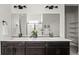 Bathroom featuring a double sink vanity with white countertops at 12547 Lake View St, Longmont, CO 80504