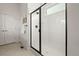 Bathroom with white tile walk-in shower and black shower door trim at 12547 Lake View St, Longmont, CO 80504