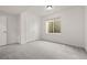 Bright bedroom with soft carpeting, closet access, and natural light from a window at 12547 Lake View St, Longmont, CO 80504