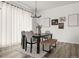 Inviting dining room boasts stylish decor, a large table, and modern chandelier at 12547 Lake View St, Longmont, CO 80504