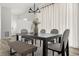 Bright dining area featuring a wooden table, stylish seating, and contemporary lighting at 12547 Lake View St, Longmont, CO 80504