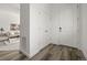 Bright entryway with wood floors, coat closet and view into the living area, creating a welcoming first impression at 12547 Lake View St, Longmont, CO 80504