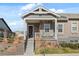 Charming front exterior featuring a covered porch and landscaped yard, adding curb appeal to this inviting home at 12547 Lake View St, Longmont, CO 80504