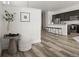 A modern kitchen seamlessly connected with the dining area, perfect for entertaining, offers abundant countertop space at 12547 Lake View St, Longmont, CO 80504