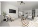 Bright living room with a view into the dining and kitchen area, creating an open and inviting atmosphere at 12547 Lake View St, Longmont, CO 80504