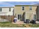 Backyard view featuring a lawn, fence, patio, and outdoor seating, ideal for relaxation at 3253 S Estes St, Lakewood, CO 80227