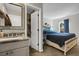 En-suite bathroom and bedroom features updated granite counters and modern fixtures at 3253 S Estes St, Lakewood, CO 80227