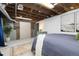 Bedroom in finished basement with exposed wood beams at 4528 W 34Th Ave, Denver, CO 80212