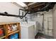 Basement laundry area featuring a washer, dryer, and shelving for supplies at 4528 W 34Th Ave, Denver, CO 80212