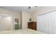 Well-lit bedroom featuring neutral paint, a closet, dresser, and ample space at 4528 W 34Th Ave, Denver, CO 80212