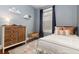Comfortable bedroom with a twin bed, neutral walls, ample lighting, and stylish décor for a restful retreat at 4528 W 34Th Ave, Denver, CO 80212