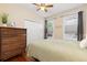 Bright bedroom with a ceiling fan, neutral paint, natural light, and closet offering a comfortable retreat at 4528 W 34Th Ave, Denver, CO 80212