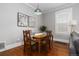 Charming dining area with hardwood floors, natural light, and stylish table setting, perfect for gatherings at 4528 W 34Th Ave, Denver, CO 80212