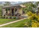 Inviting front porch with seating, showcasing a well-maintained facade and landscape at 4528 W 34Th Ave, Denver, CO 80212