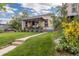 Inviting front porch and lush lawn, showcasing a well-maintained facade with landscaping at 4528 W 34Th Ave, Denver, CO 80212